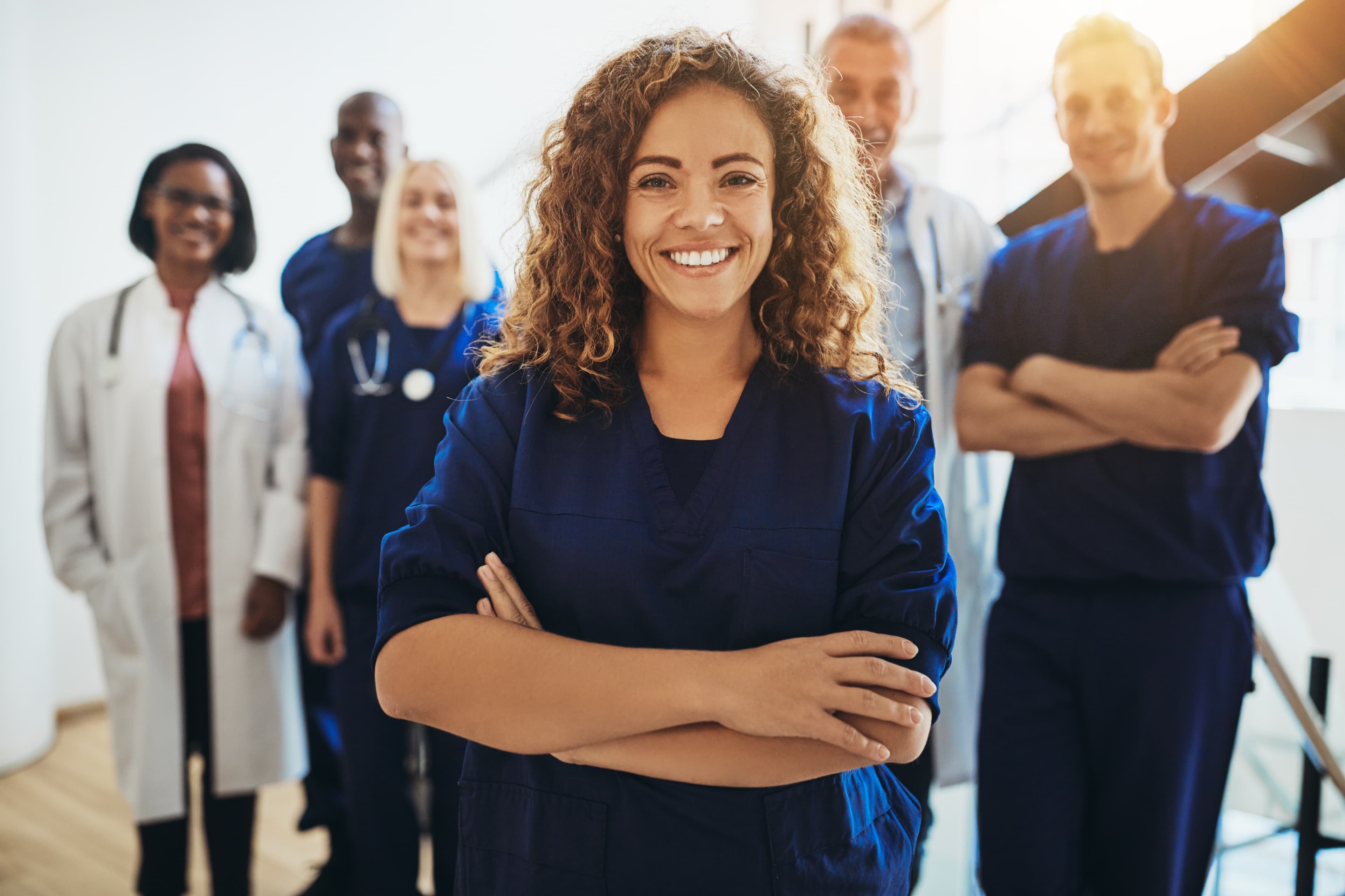 Clinical team in hospital scrubs.